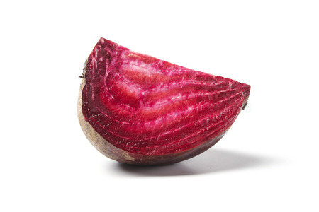 Slice of beetroot isolated on whiteの写真素材
