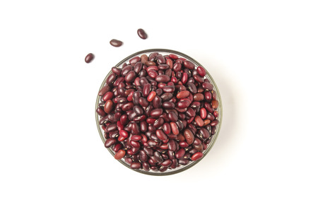 Grains of red beans in a glass bowl isolated on white