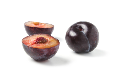 Black ripe plums isolated on white backgroundの写真素材