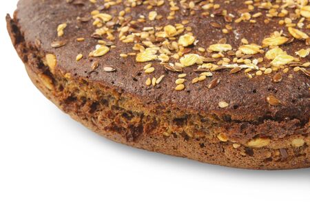 Rye bread loaf sprinkled with grains of cereals