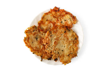 Fried potato pancakes on a porcelain saucer isolated on white background. View from above