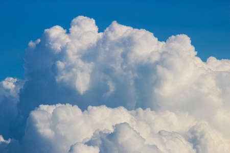White cumulus clouds on a blue sky backgroundの写真素材