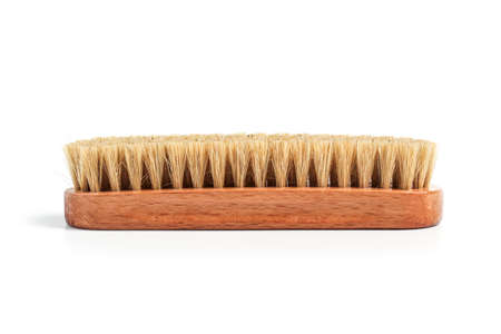 Clothing brush with wooden handle isolated on white background
