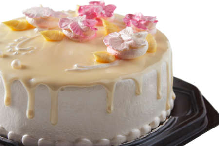 Festive sponge cake close up isolated on whiteの写真素材