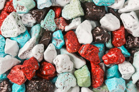 Dragee candies in the form of multi-colored pebbles as a backgroundの写真素材