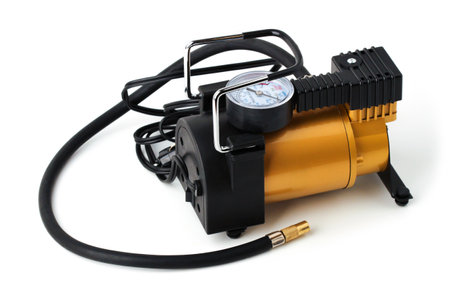 Electric car tire pump isolated on white backgroundの写真素材