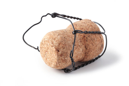 Wooden cork with muselet from champagne bottle isolated on white backgroundの写真素材