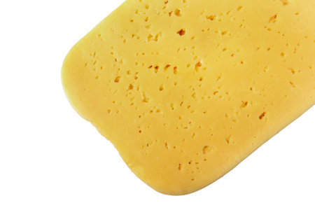 Sliced piece of cheese head isolated on white background. View from aboveの写真素材