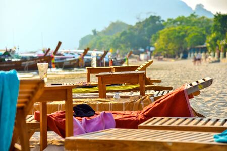 Beach with sunbed at tropical beach. Relax deck chair vacation.の写真素材
