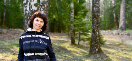 Woman in the forest on a sunny day
