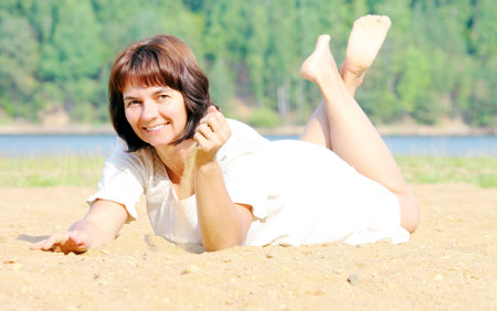 Woman on the sandの写真素材