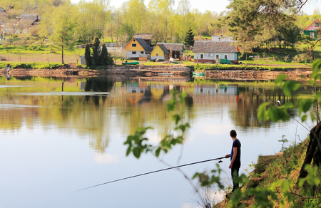 Fisherman with a fishing rodの写真素材