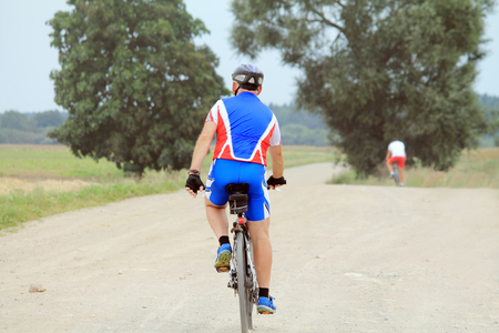 walk on bicycles on country roadsの写真素材