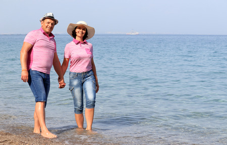 couple walking near the seaの写真素材