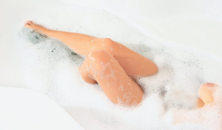 woman washes in the bathroomの写真素材