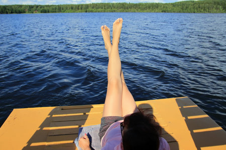 female feet on the beachの写真素材