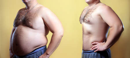 fat man on yellow backgroundの写真素材