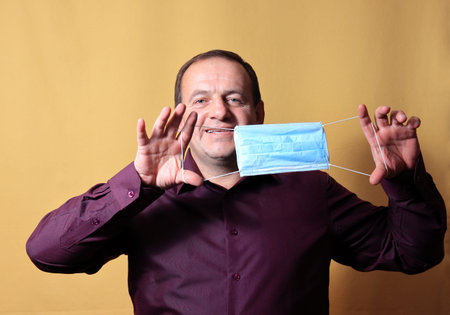 portrait of a man on a yellow background