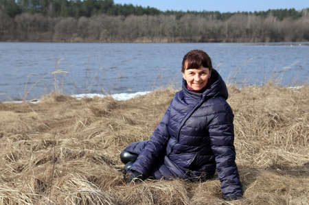 portrait of a woman by the lakeの写真素材