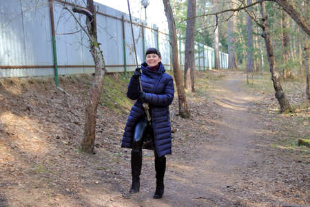 portrait of a woman on a swingの写真素材