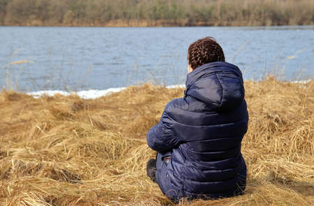 portrait of a woman by the lakeの写真素材