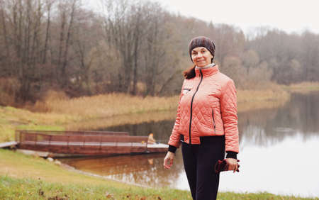 Woman portrait in nature in autumnの写真素材