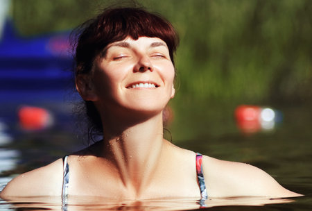 a woman in the waterの写真素材