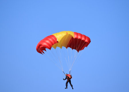 flying with a parachute on a summer dayの写真素材