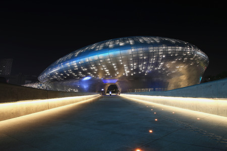 SEOUL, SOUTH KOREA - August 13, 2014: Dongdaemun Design Plaza at Night, New development in Seoul, designed by Zaha Hadid. Photo takenAugust 13, 2014 in Seoul, South Korea.のeditorial素材