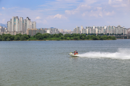 The man is enjoying the scooter at hanriver south korea;の写真素材