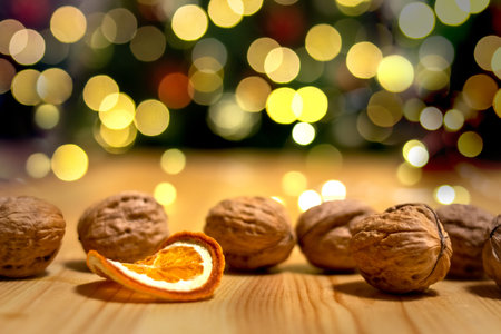 Walnuts and dried orange near the Christmas tree