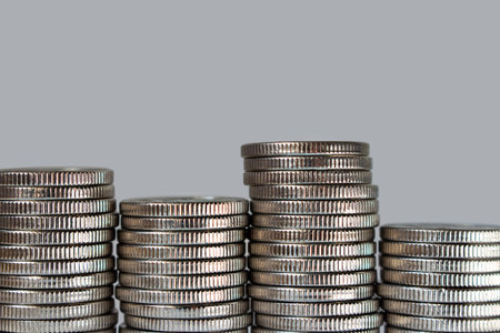 stacks of coins on a gray background