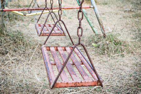 An Old Swing At Abandoned Playgroundの写真素材