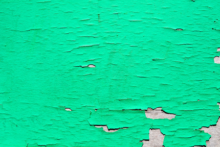 old green cracked paint on wood wallの写真素材