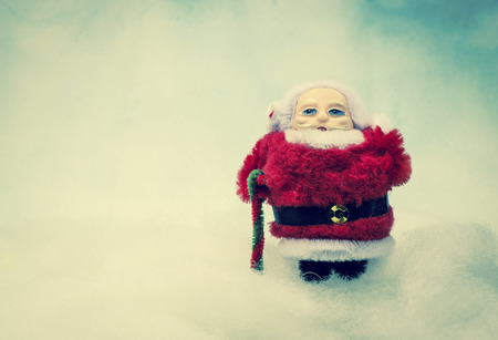 A Santa Claus toy holdingの写真素材
