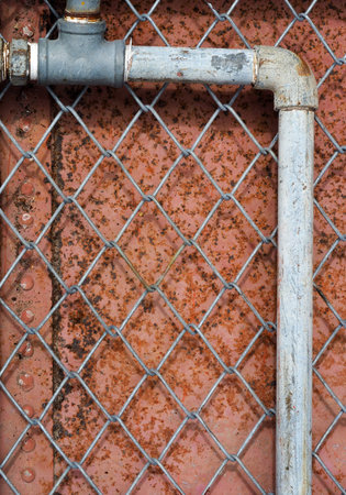 The wire mesh is in front of iron sheet.