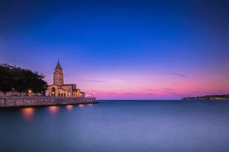 Spanish cityscape. Asturias gijon San Pedro church during duskの写真素材