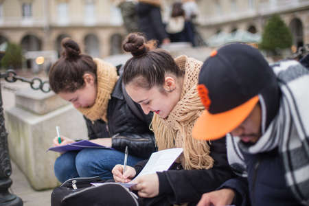 Young university Erasmus students in a multicultural group, friends enjoy together traveling in Corunna Galicia Spain. Multiracial lifestyle millennials friendshipの写真素材