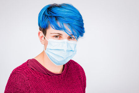 how to put a mask. Woman with virus breath maskの写真素材