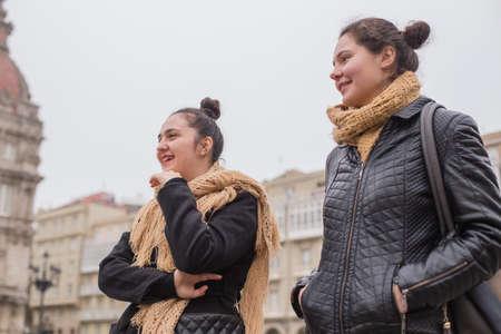 Young university Erasmus students in a multicultural group, friends enjoy together traveling in Corunna Galicia Spain. Multiracial lifestyle millennials friendshipの写真素材