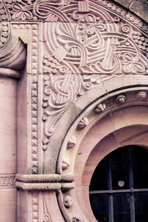 Old rustic vintage wood door closeup background. Ornamental gate detail texture pattern traditional ancient spanish design.の写真素材