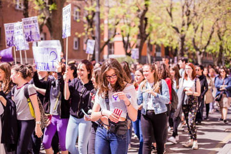 A group of people walking in front of a crowdのeditorial素材