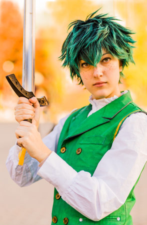 Young woman cosplay character hero fan. Fantasy culture of clothing with halloween costume or...