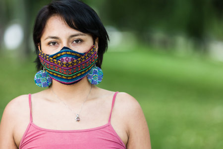 Latin America Bolivian woman with traditional pattern cloth mask. Handmade quechua native textile...