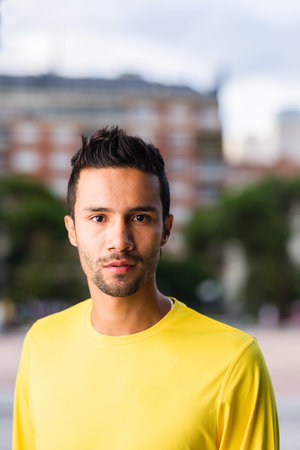 Young latin man headshot. Colombian isolated hispanic portrait in urban lifestyleの写真素材