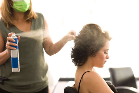 Latin brazilian hairdressing attending a client for desss ine autumn colorsの写真素材