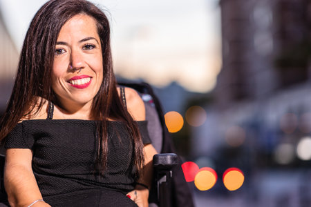 Wheelchair Dysplasia disability healthcare insurance. Hispanic mid woman lifestyleの写真素材