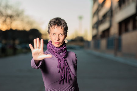 8 march feminist movement womens day. mature mid Hispanic woman hand activism gesture
