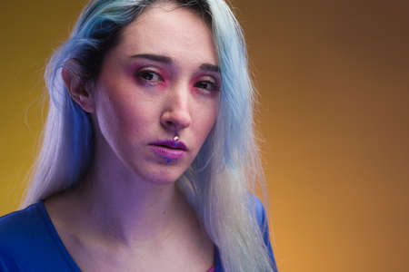 modern Mexican trend cyber style glow emotion studio light. neon Latin woman.の写真素材