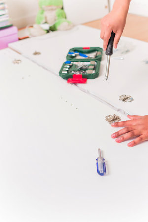 independent and success Bolivian Latin woman assembly and fix repair in moving houseの写真素材